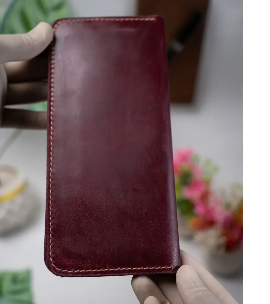 Back profile of full grain leather long travel organizer wallet with button.webp
