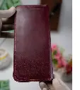 Back profile of full grain leather long travel organizer wallet with button.webp